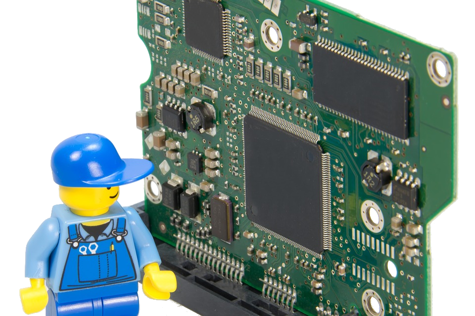 Lego man technician contemplating a giant circuit board