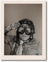 Stern little boy in goggles and pilot hat salutes