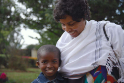 Dr. AlyceJo Mwangi hugs a smiling student at Jubilee Children's Center