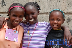 Three healthy girls smile during our trip in Spring 2009