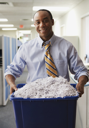 Businessman carrying his shredding